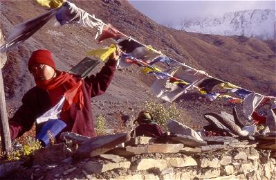 Sangye Lamo repairs a line of prayer flags at Muktinath